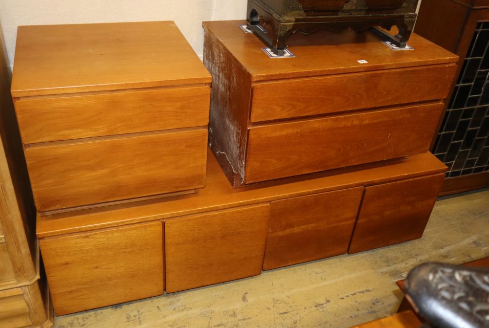 A mid century design teak low cabinet, W.168cm, D.53cm, H.50cm and two two drawer chests